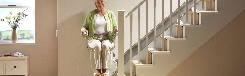 woman in stair chair with seat belt