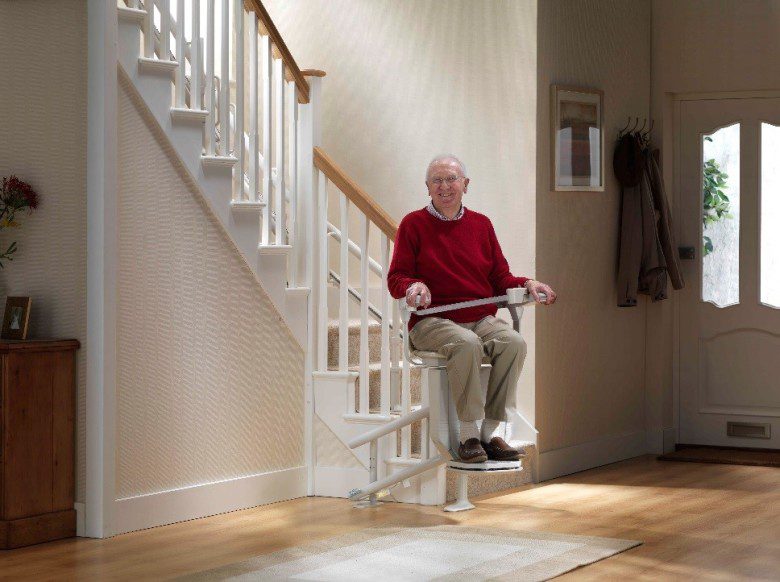 man in curved stair lifts