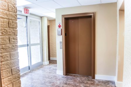 LULA Elevator with closed brown doors